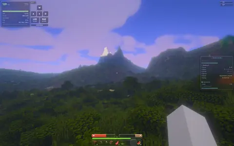 A lavender atmosphere over a forested mountain.