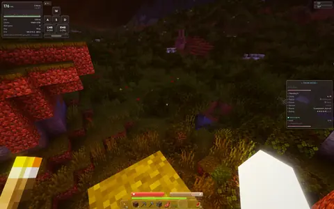 Colored illumination across grass at night.