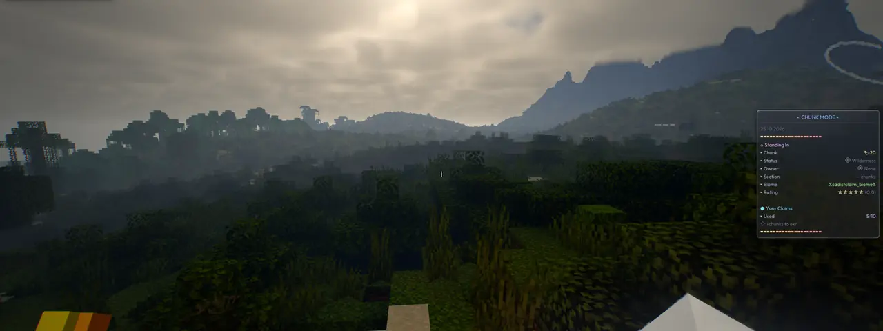 Distant hills and a tree-covered Minecraft landscape in MCC.