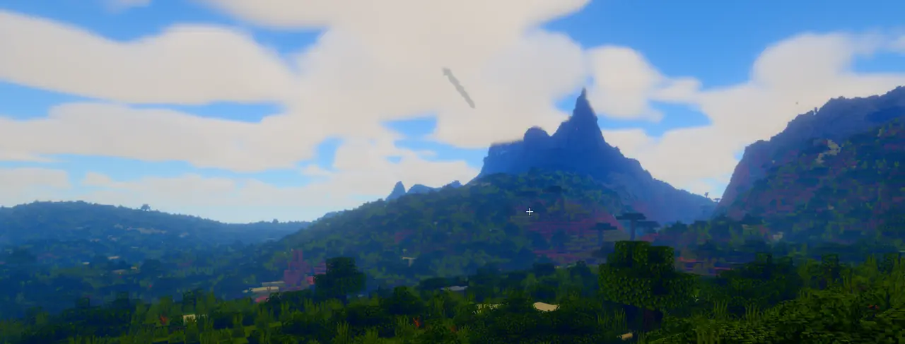 Soft daylight over a mountain and forest in MCC.